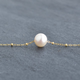 White freshwater pearl necklace with satellite chain from Yay Hawaii, close-up of the elegant jewelry piece.