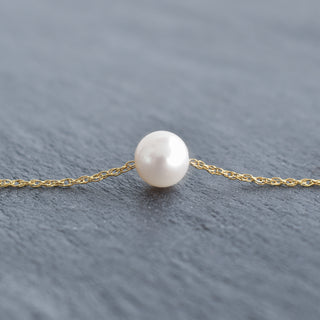White freshwater pearl necklace with a double rope chain from Yay Hawaii, featuring elegant, lustrous pearls and a stylish silver clasp.