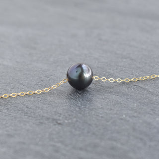 Black freshwater pearl necklace with a sleek cable chain from Yay Hawaii, showcasing a single lustrous pearl.