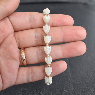 Yay Hawaii Pikake and metal bead accent stretchy bracelet with floral design, available in adult and child sizes.