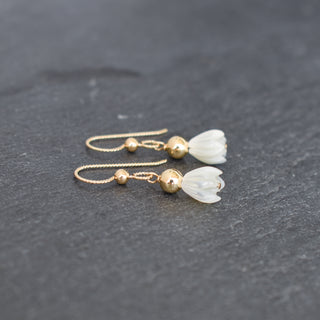 Small mother of pearl Pikake earring with 4mm accent bead, featuring natural floral design and Yay Hawaii branding.