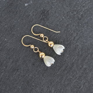 Small mother of pearl Pikake earring with a 4mm accent bead, crafted by Yay Hawaii, featuring delicate floral design.