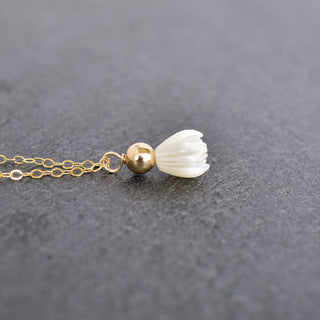 Small mother of pearl Pikake pendant necklace with 4mm accent bead from Yay Hawaii, showcasing the delicate floral design.