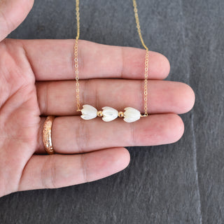 Triple small Mother of Pearl Pikake bar necklace with metal accent beads, featuring delicate floral-inspired jewelry from Yay Hawaii