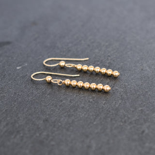 Yay Hawaii modern metal beaded minimalist stick earrings with sleek, contemporary design and subtle metallic accents.