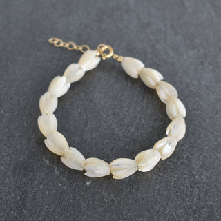 Colorful Pikake bracelet by Yay Hawaii, worn on adult or child wrist, featuring floral design and traditional Hawaiian style.