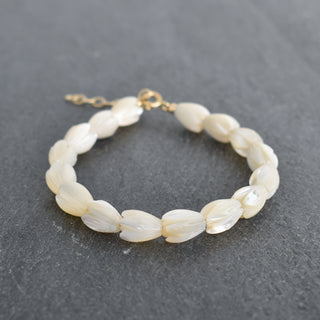 Yay Hawaii Pikake bracelet in adult and child sizes, featuring delicate floral design with white jasmine flowers on a woven band.