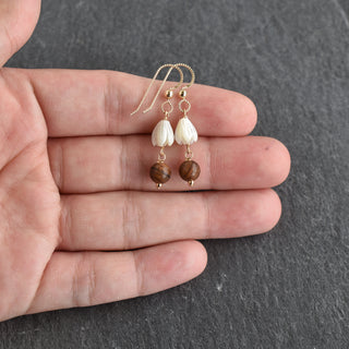 Linked small mother of pearl Pikake and rosewood earrings by Yay Hawaii featuring floral and wooden design elements.