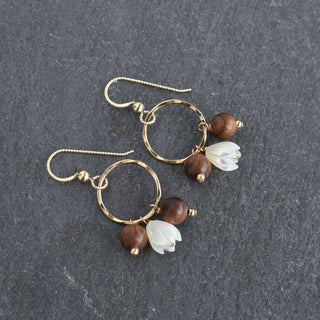 Small hoop earrings by Yay Hawaii featuring mother of pearl Pikake and rosewood beads, showcasing intricate Hawaiian-inspired jewelry design.