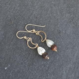 Crescent moon earrings by Yay Hawaii featuring small mother of pearl Pikake flowers and rosewood accents.