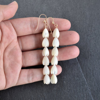 Long medium mother of pearl Pikake earrings by Yay Hawaii featuring elegant floral design and shimmering pearl accents.