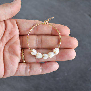 Large Yay Hawaii hoop earrings featuring small Pikake floral charms on shiny metal hoops.