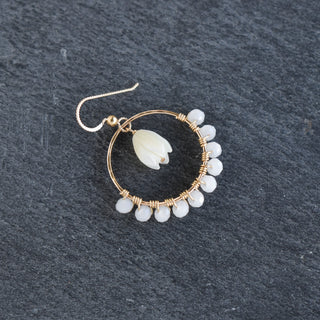 Medium Yay Hawaii hoop earrings with crystal glass beads and a mother of pearl Pikake flower pendant, hanging from the center.