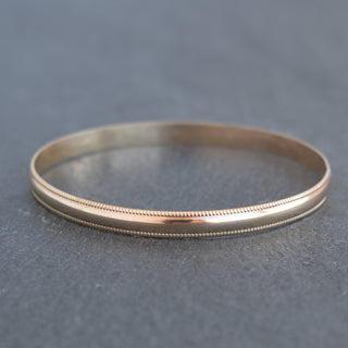 Yay Hawaii Malino smooth patterned bangle with intricate design, showcasing glossy finish and stylish accessory for the wrist.
