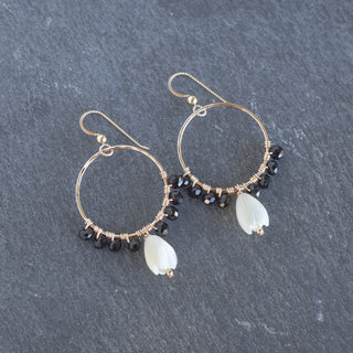 Dangling 10mm Pikake flower and black wire wrapped beads jewelry piece by Yay Hawaii, close-up view showing intricate details.