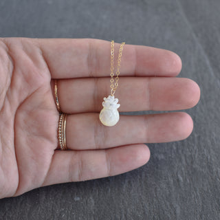 Carved mother of pearl pineapple necklace from Yay Hawaii featuring intricate detailing and tropical-inspired design.