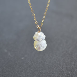 Carved Mother of Pearl pineapple necklace by Yay Hawaii featuring a detailed, natural shell pendant on a delicate chain.