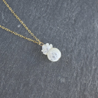 Carved mother of pearl pineapple necklace by Yay Hawaii featuring a detailed tropical fruit pendant on a delicate chain