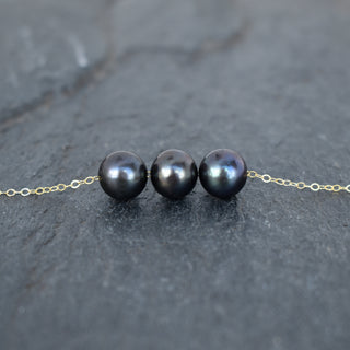 Black pearl floating necklace with 9-9.5mm pearls from Yay Hawaii, showcasing a delicate, elegant design on a white background.