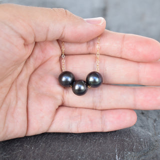 Black pearl floating necklace with triple 9-9.5mm pearls from Yay Hawaii, featuring a delicate clasp and elegant design.