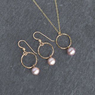 Small hoop earrings with light purple pearls by Yay Hawaii, featuring delicate silver hoops and elegant pearl accents.
