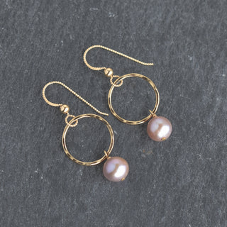 Small hoop earrings with light purple pearls from Yay Hawaii showcasing elegant jewelry design