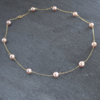 Dainty light purple pearl station necklace by Yay Hawaii, featuring small lustrous pearl beads on a delicate chain.