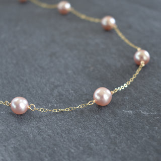 Dainty light purple pearl station necklace by Yay Hawaii featuring small, lustrous pearls on a delicate chain.