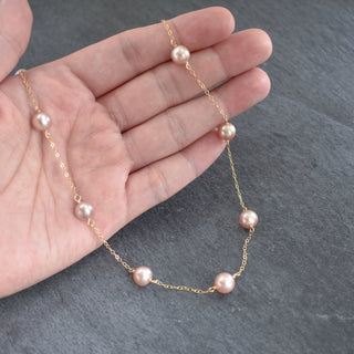 Dainty light purple pearl station necklace by Yay Hawaii featuring evenly spaced pearl beads on a delicate chain.