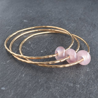 Yay Hawaii rose quartz rondelle gemstone bangle featuring polished pink beads on a flexible stretch bracelet