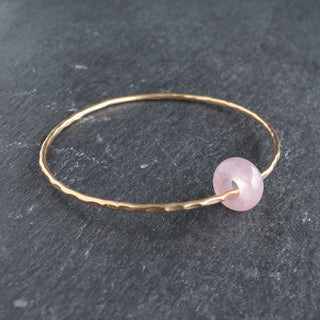 Yay Hawaii rose quartz rondelle gemstone bangle featuring polished pink beads on a flexible jewelry bracelet.