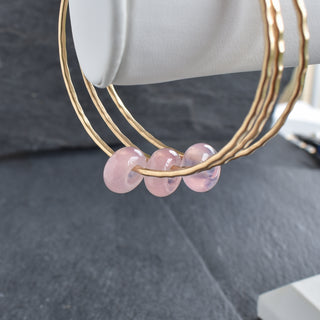 Rose quartz rondelle gemstone bangle from Yay Hawaii, featuring smooth pink stone beads on a delicate bracelet.