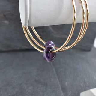 Amethyst rondelle gemstone bangle by Yay Hawaii, featuring polished purple beads on a delicate silver bracelet.
