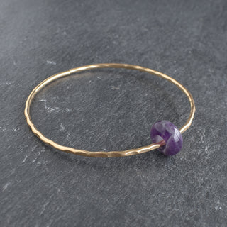 Yay Hawaii amethyst rondelle gemstone bangle featuring purple beads and silver clasp on a white background.