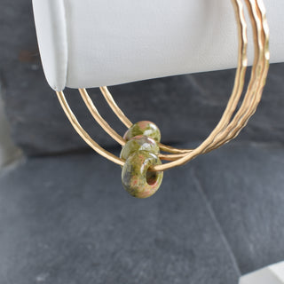Unakite gemstone Rondelle bangle with polished, colorful beads on a delicate jewelry bracelet by Yay Hawaii