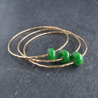 Yay Hawaii jade rondelle gemstone bangle featuring smooth, polished green jade beads on a flexible bracelet, stylish and natural.