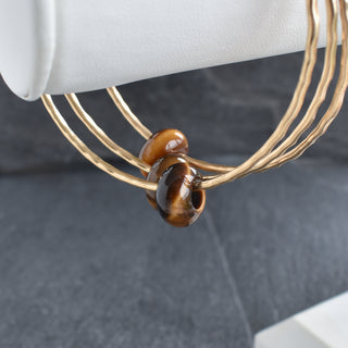 Tiger Eye Rondelle gemstone bangle by Yay Hawaii showing smooth, polished brown and gold-toned beads on a flexible bracelet.