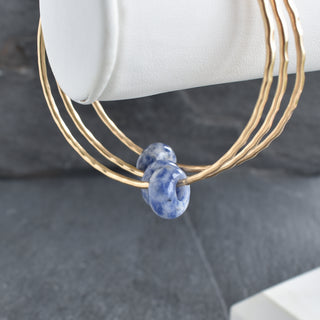 Blue Spot Jasper Rondelle Gemstone Bangle featuring polished blue and brown jasper beads on a flexible bracelet.