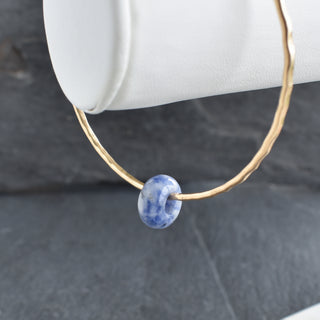 Blue Spot Jasper Rondelle Gemstone Bangle featuring blue jasper beads and a stylish design, perfect for jewelry enthusiasts.