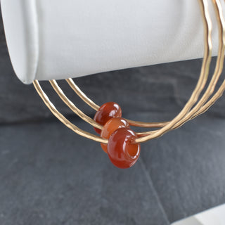 Red Agate Rondelle Gemstone Bangle featuring polished red agate beads and a stretch design by Yay Hawaii.
