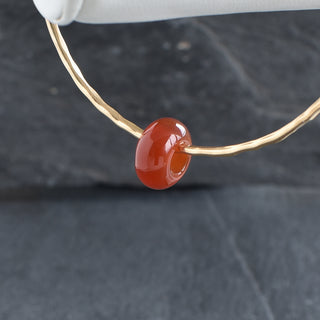 Red Agate Rondelle gemstone bangle with Yay Hawaii branding, featuring polished red agate beads on a flexible jewelry band.