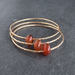 Red Agate Rondelle gemstone bangle by Yay Hawaii featuring polished red agate beads on a flexible bracelet.