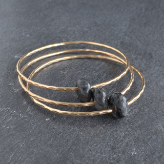 Larvikite gemstone bangle with round rondelle beads, featuring natural dark blue and gray hues, handcrafted by Yay Hawaii.