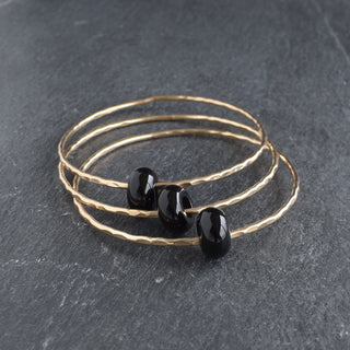 Black Agate Rondelle Gemstone Bangle featuring smooth black agate beads and a stylish design, perfect for everyday wear.