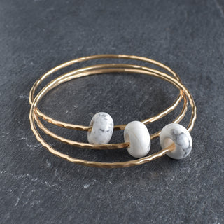 Howlite rondelle gemstone bangle by Yay Hawaii, featuring smooth white beads on a flexible bracelet for stylish wear.