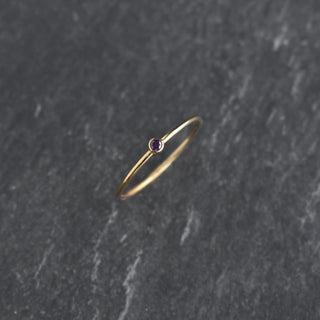 Purple CZ stacking ring featuring a February amethyst birthstone, crafted by Yay Hawaii, with a sleek band and sparkling gemstone.