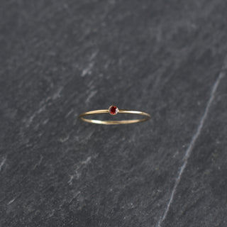 Dark red CZ stacking ring with garnet birthstone detail from Yay Hawaii, showcasing a stylish and elegant jewelry design.