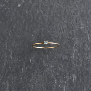 Light aqua CZ stacking ring with March aquamarine birthstone, featuring a delicate band from Yay Hawaii.