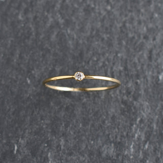 Clear CZ stacking ring featuring April diamond birthstone by Yay Hawaii, shown in a close-up of the jewelry on a neutral background.