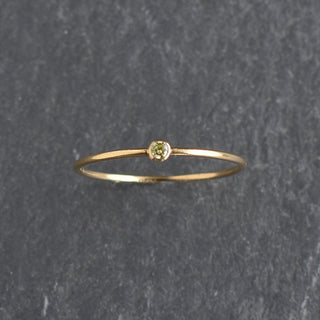 Light green CZ stacking ring with peridot birthstone detail, designed by Yay Hawaii, showcasing elegant jewelry craftsmanship.